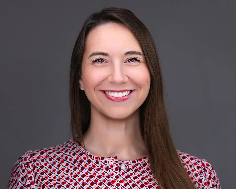 Professional conference headshot of a smiling woman photographed in Fort Lauderdale.