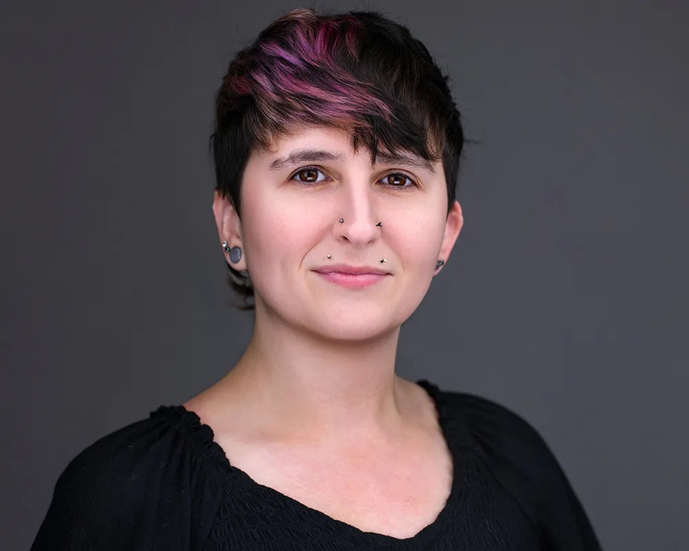 Professional convention headshot created at an on-site attendee headshot lounge.