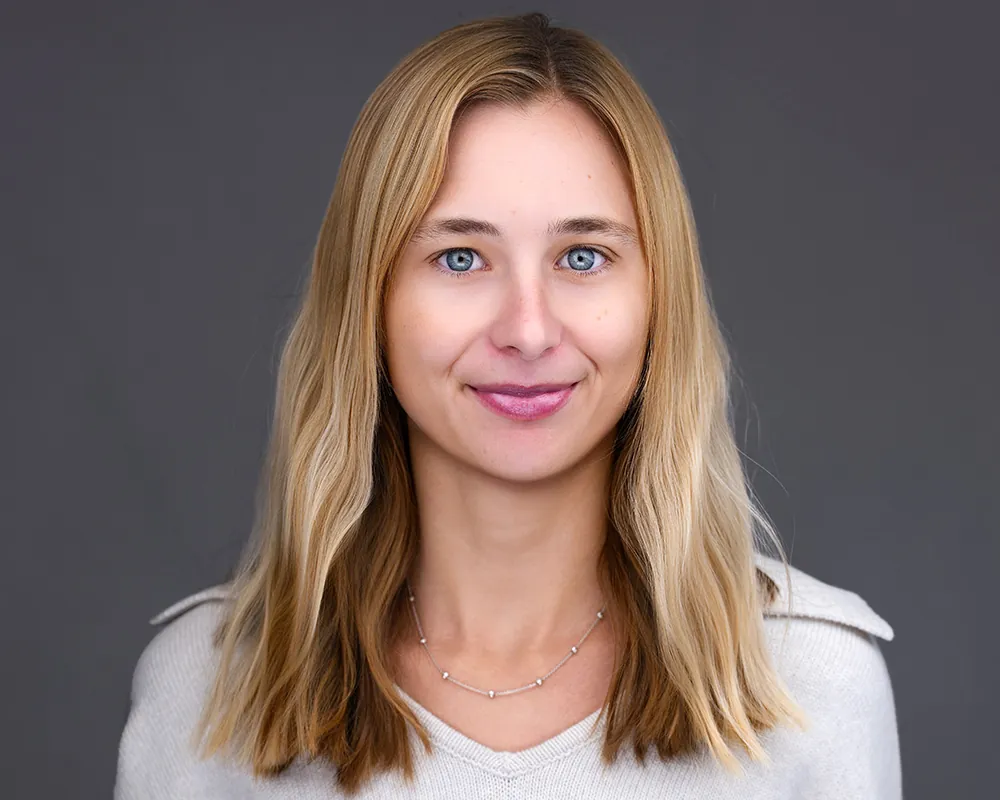 Professional convention headshot of a smiling attendee photographed in Fort Lauderdale.