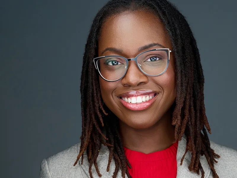 Smiling professional in glasses photographed in the Fort Lauderdale studio