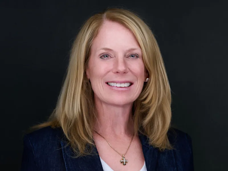 Professional corporate headshot of a smiling blonde Recovery United team member.
