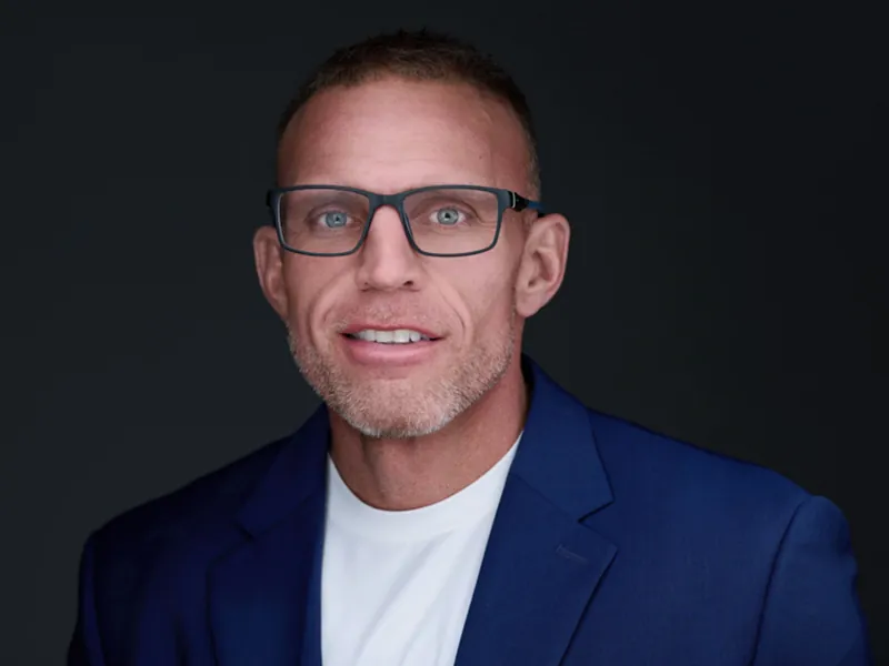 Professional corporate headshot of a Recovery United team member in a blue blazer.