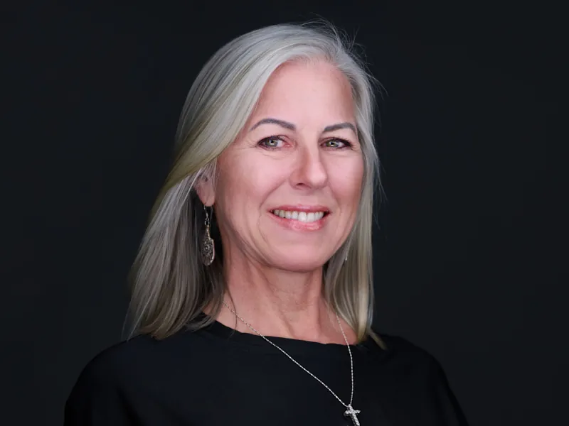 Professional corporate headshot of a silver-haired Recovery United team member.