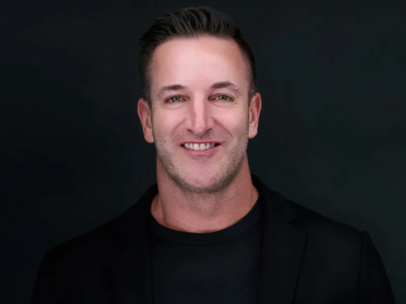 Professional corporate headshot of a smiling Recovery United team member.