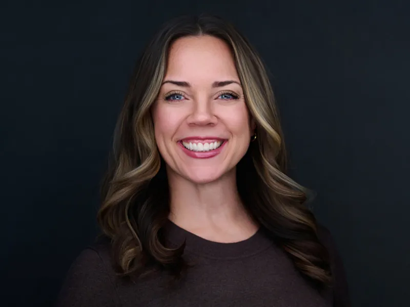 Professional corporate headshot of a smiling Recovery United team member.