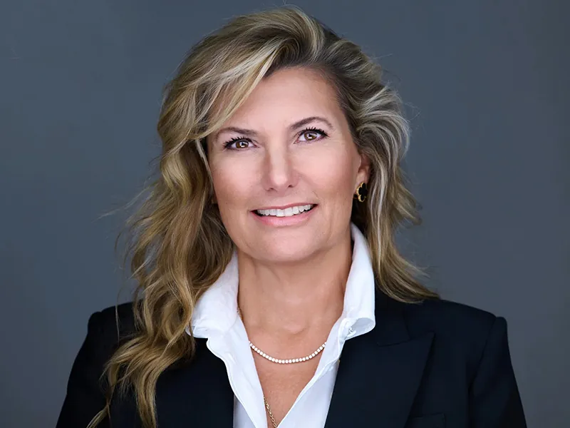 Professional corporate headshot of a Rockefeller Capital team member in business attire.