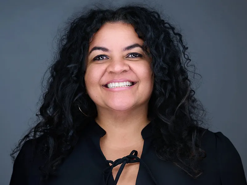 Professional corporate headshot of a smiling Rockefeller team member.