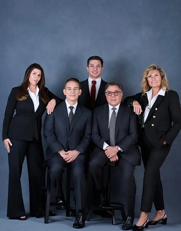 Professional Rockefeller corporate team group portrait with seated and standing employees.